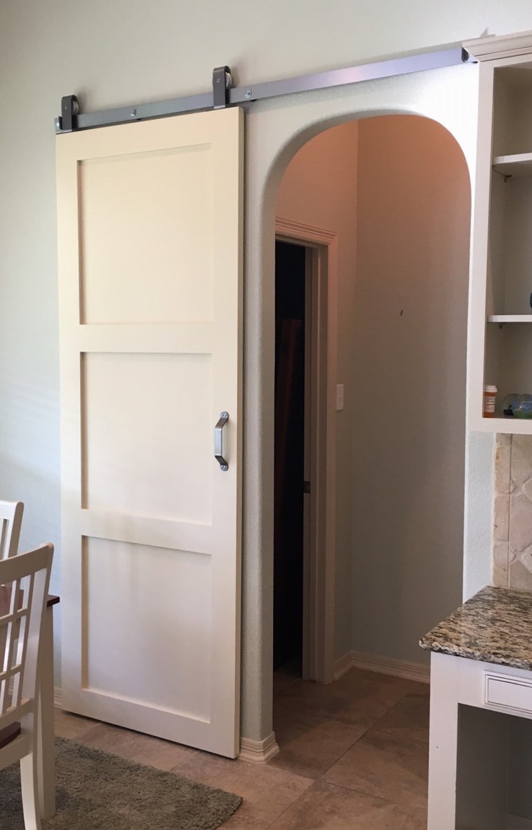 Contemporary style barn door in Phoenix kitchen.